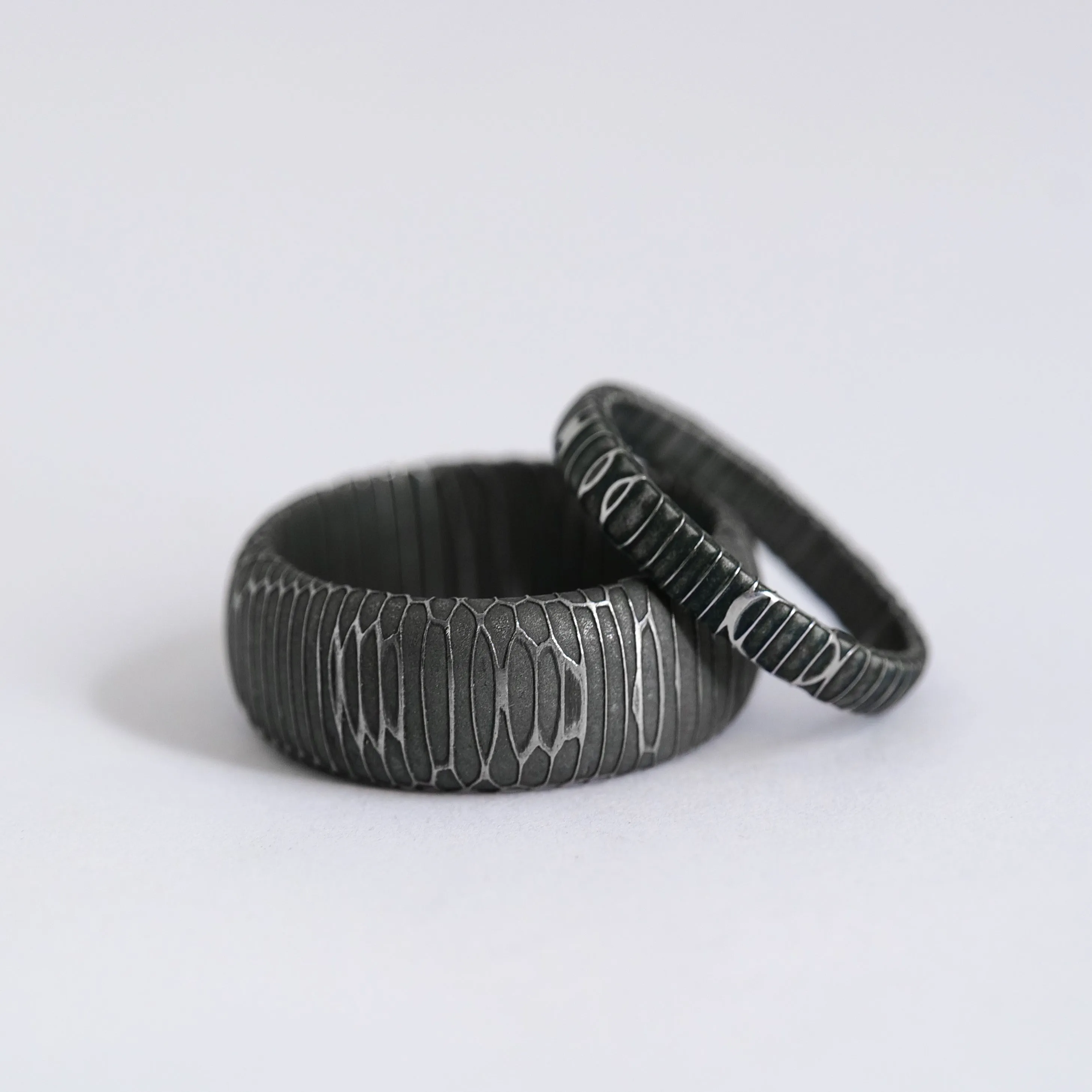 Matching His and Hers Spirograph Damascus Steel Wedding Rings