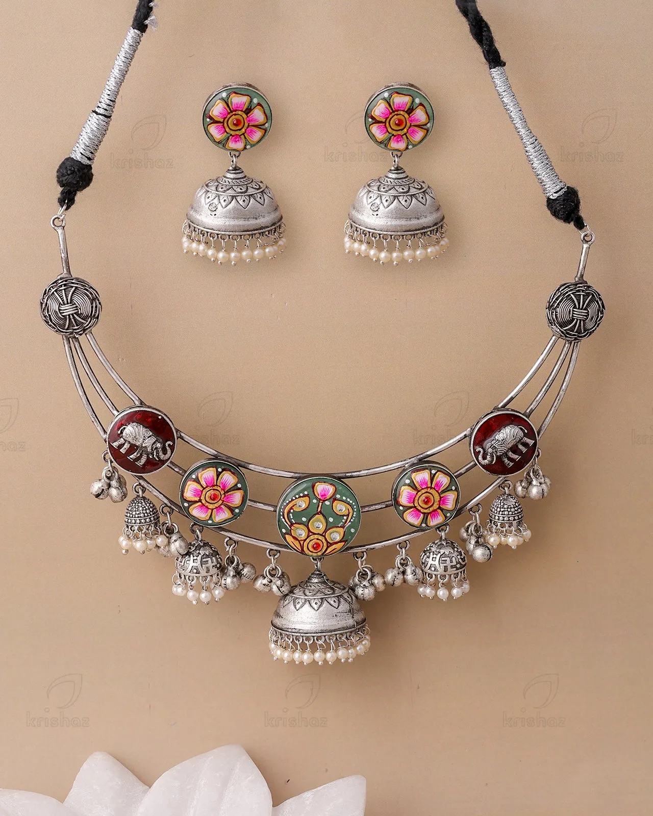 Reeti Meenakari Jhumki Choker Set could be optimized for better clarity and appeal in an e-commerce setting. Heres an improved version:

Traditional Reeti Meenakari Jhumki Choker Set