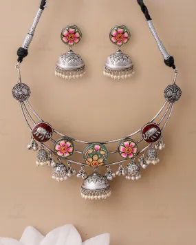 Reeti Meenakari Jhumki Choker Set could be optimized for better clarity and appeal in an e-commerce setting. Heres an improved version:

Traditional Reeti Meenakari Jhumki Choker Set